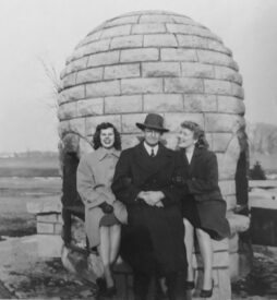 A man and two women at the Graeser Park beehive in 1947